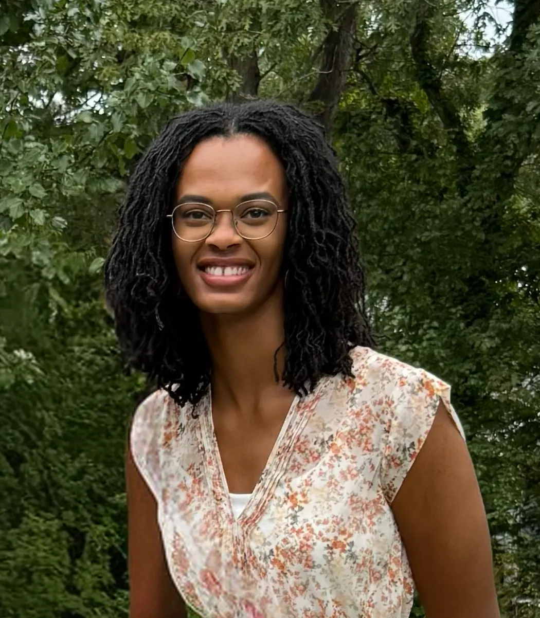 Adriahna Conway portrait with a background of trees