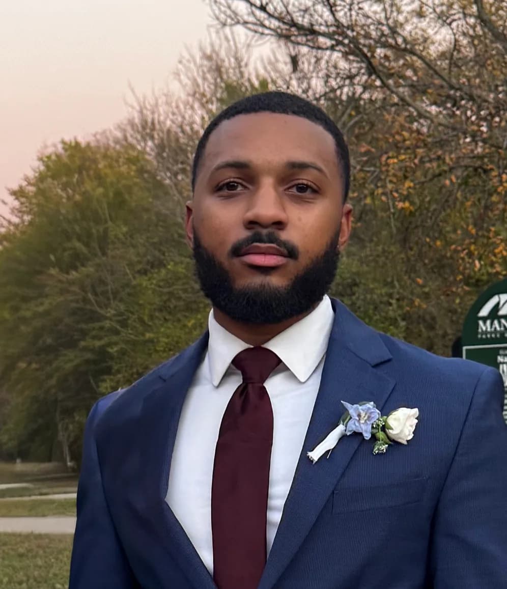 Caleb Ridgley in a suit and tie