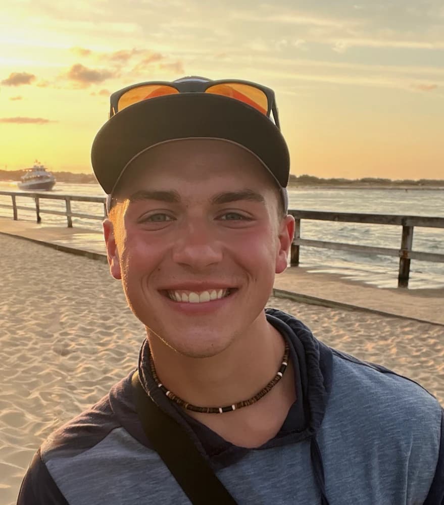 Caleb Taylor smiling at the beach