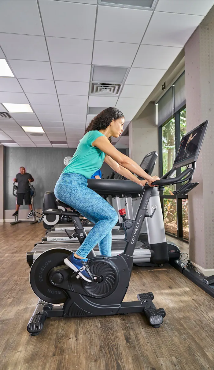 2 people running on treadmill